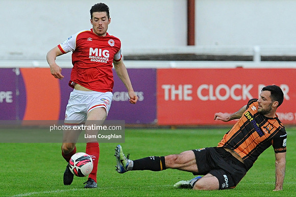 Lee Desmond evades the challenge of Patrick Hoban.