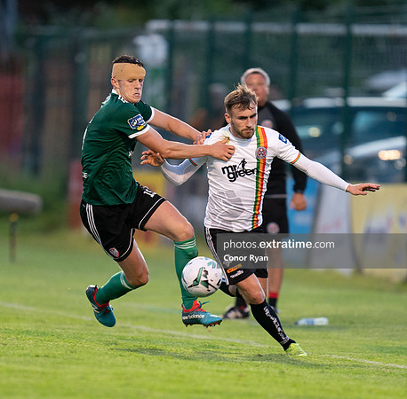 Luke Wade-Slater of Bohemians bursts past Eoin Toal of Derry City
