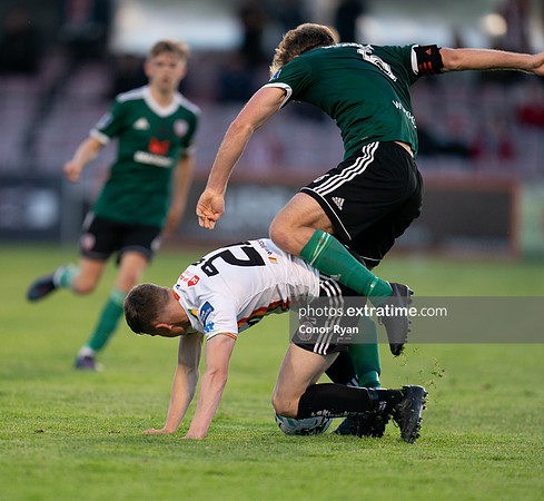 Ryan Swan Bohemians protects the ball from Gregg Sloggett of Derry City